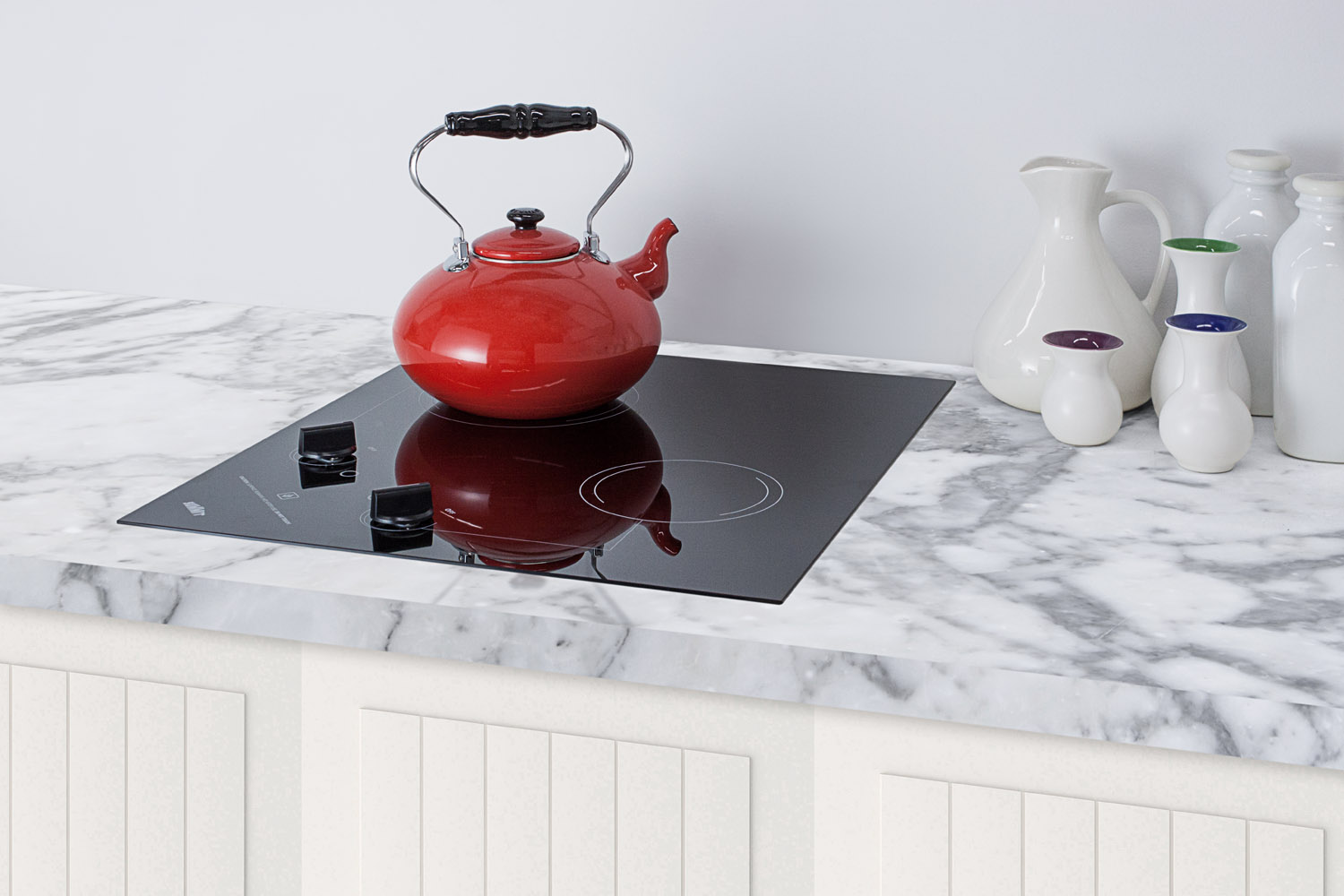 2-burner 120V electric cooktop designed for portrait or landscape installation, with smooth black ceramic glass surface